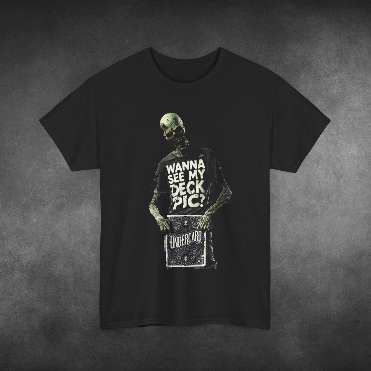 Zombie holding a deck of cards with 'Undercard' design, wearing a black t-shirt that says 'Wanna See My Deck Pic?' in bold, distressed white lettering.